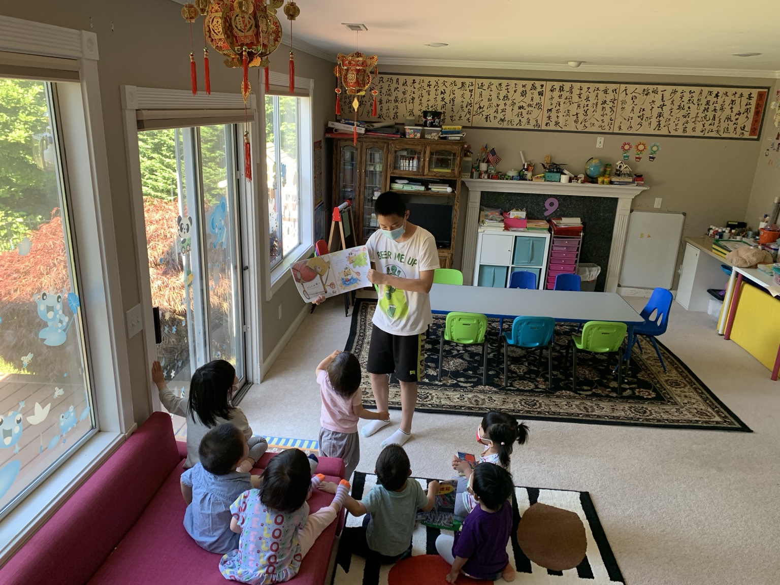LinLin reading to children in the daycare classroom